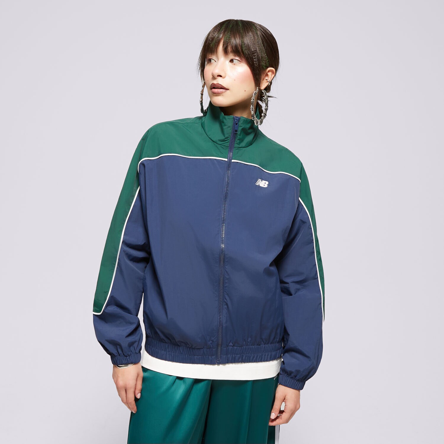 Ženske prijelazne jakne NEW BALANCE JAKNA SPORTSWEAR'S WOVEN WJ41506NNY tamno plava