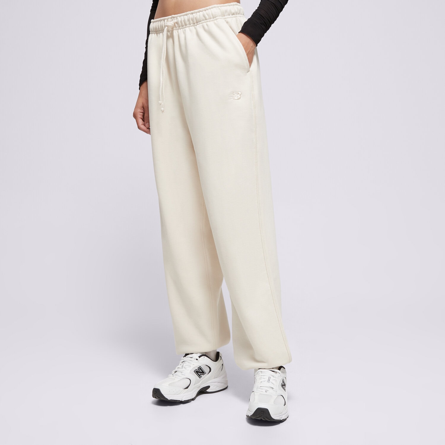 Ženske hlače NEW BALANCE HLAČE ATHLETICS FRENCH TERRY JOGGER WP41513LIN bež