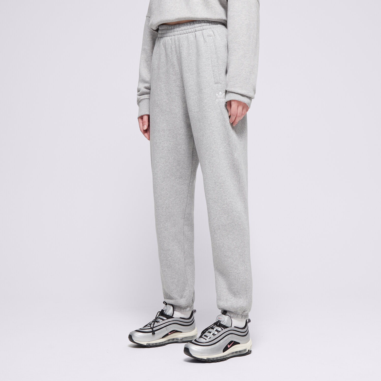 Ženske hlače ADIDAS HLAČE ESS JOGGERS IY9638 siva