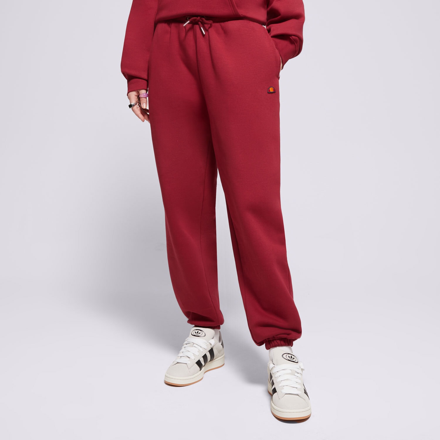 Ženske hlače ELLESSE HLAČE MUGIA JOG PANT BRGND SMG22040800 bordo