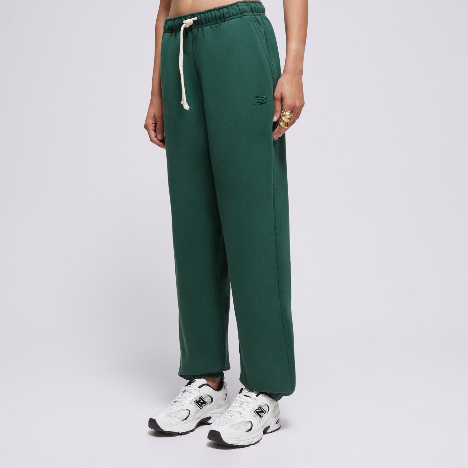 Ženske hlače NEW BALANCE HLAČE ATHLETICS FRENCH TERRY JOGGER WP41513NWG zelena