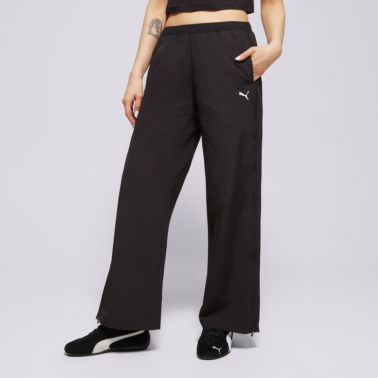 Ženske hlače PUMA HLAČE RELAXED WOVEN ZIP-OFF PANTS OP 629808 01 crna