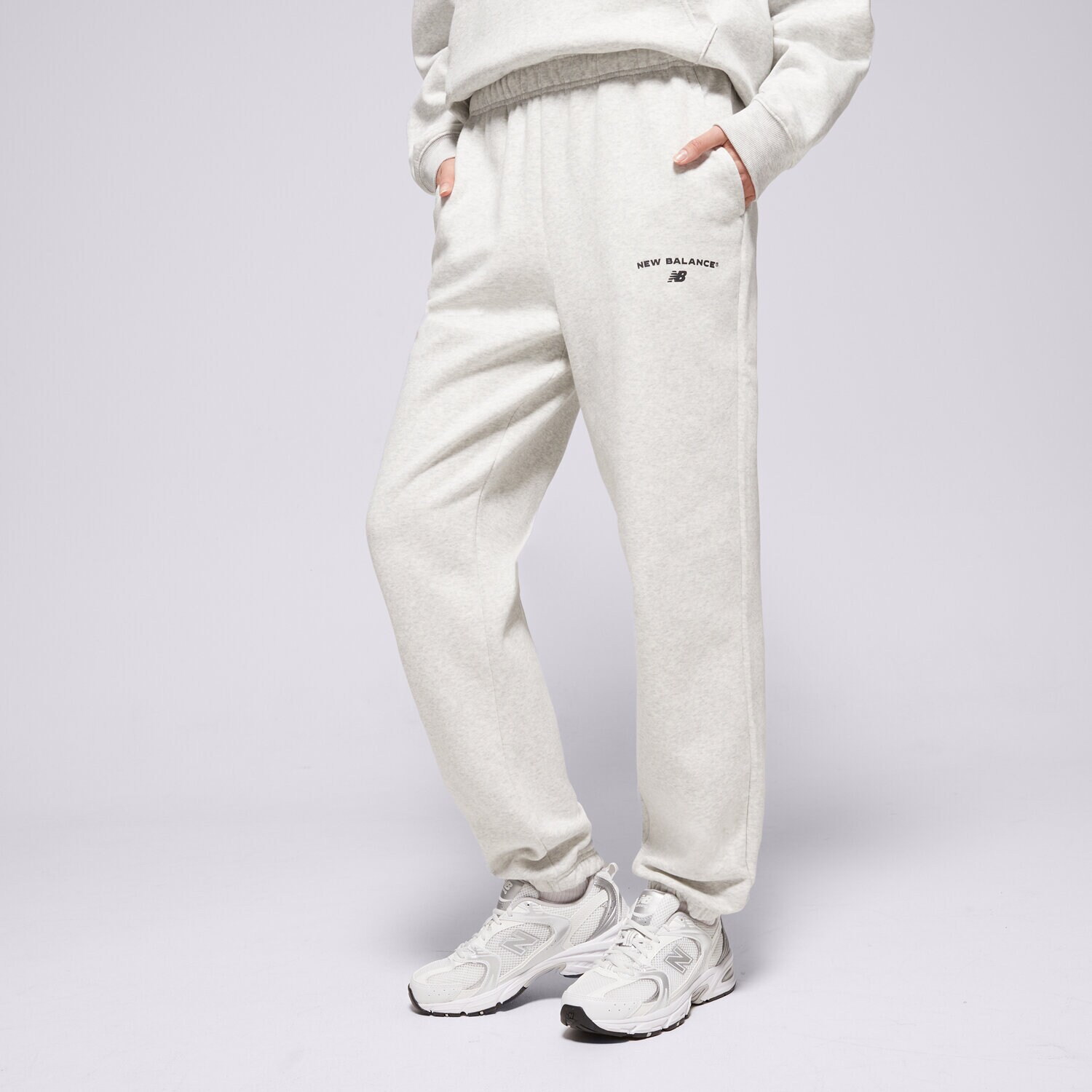 Ženske hlače NEW BALANCE HLAČE REIMAGINED JOGGER WP51500AHH siva