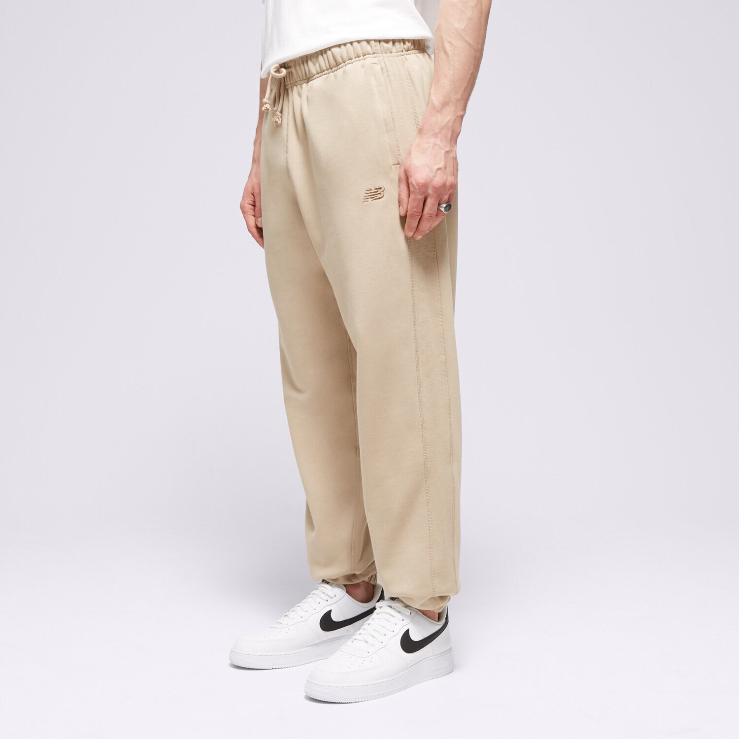 Muške hlače NEW BALANCE HLAČE ATHLETICS FRENCH TERRY JOGGER MP41508SOT bež