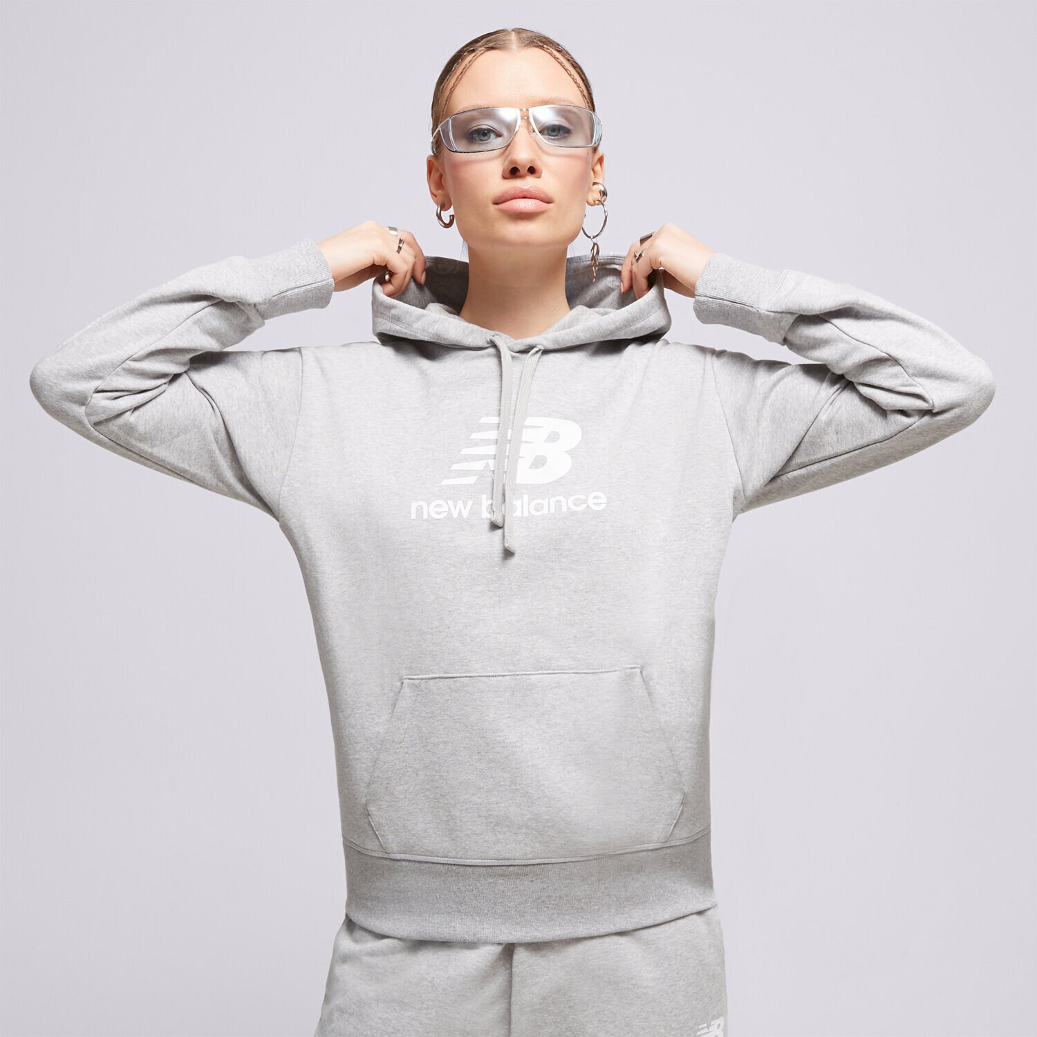 Ženske dukserice NEW BALANCE VESTA S KAPULJAČOM NB ESSENTIALS WT31533AG siva