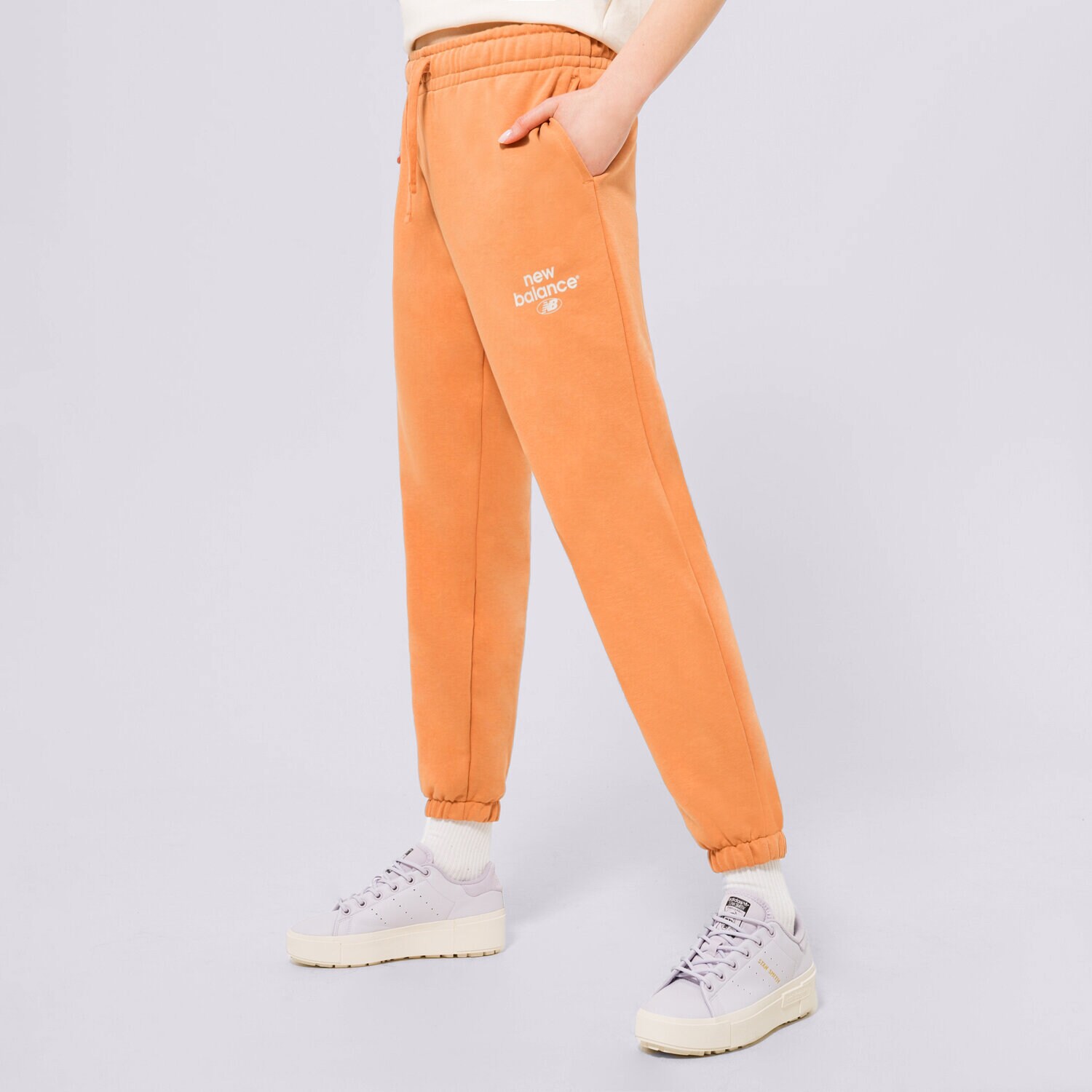 Ženske hlače NEW BALANCE HLAČE NB ESSENTIALS GRAPHIC FLEECE WP31508SEI narančasta