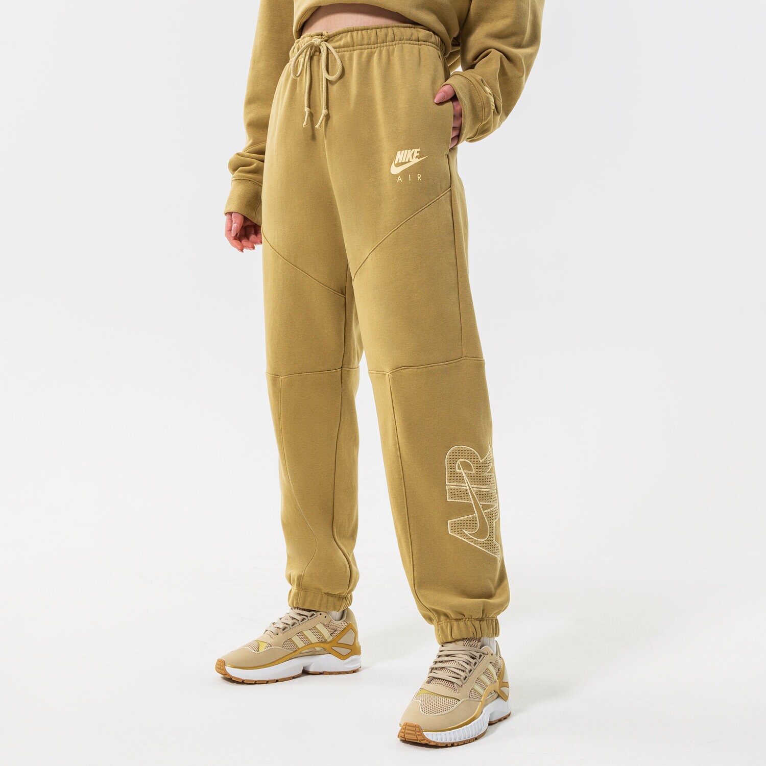 Ženske hlače NIKE HLAČE W NSW AIR FLC PANT DM6061-769 senf
