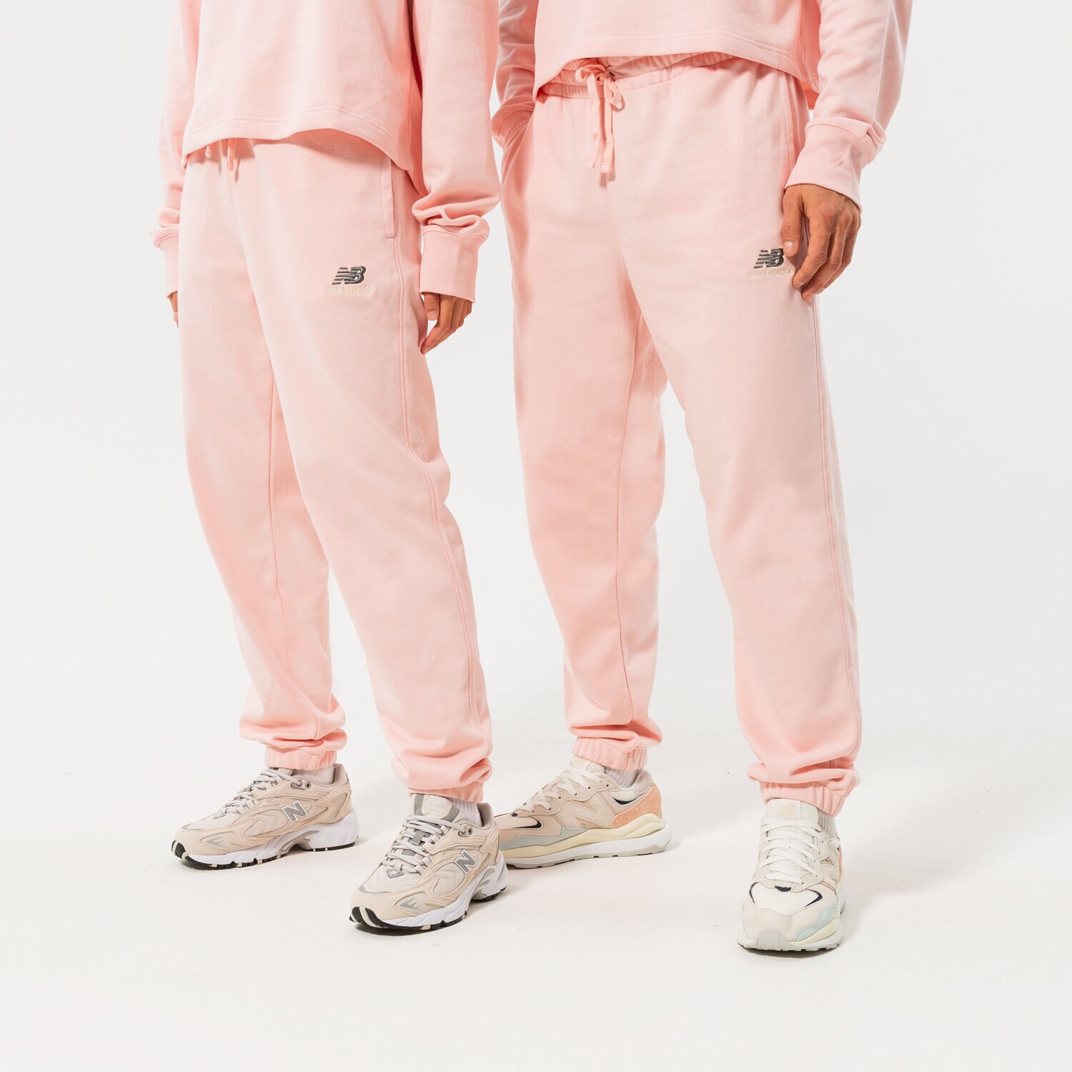 NEW BALANCE HLAČE NB ESSENTIALS UNI-SSENTIALS SWEATPANT UP21500PIE ružičasta