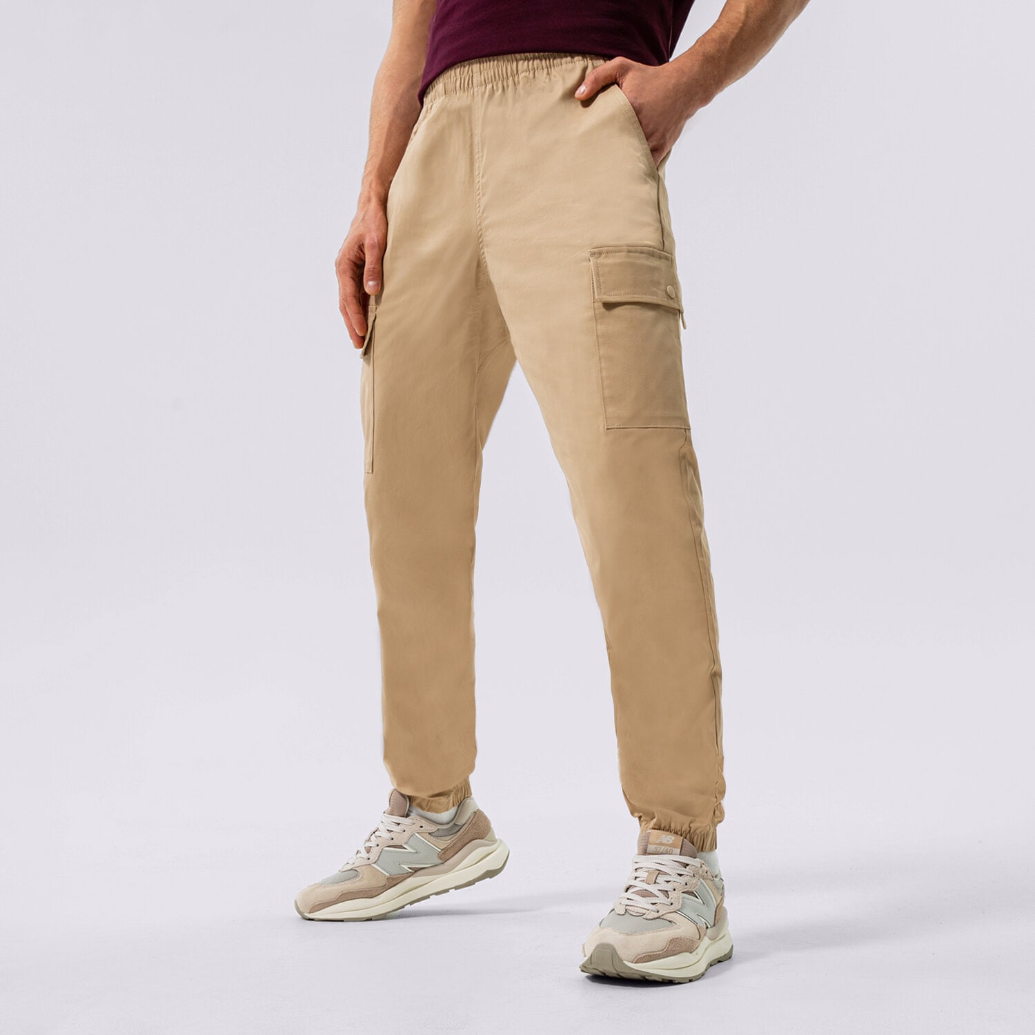 Muške hlače NEW BALANCE HLAČE NB ATHLETICS WOVEN CARGO MP13501INC bež
