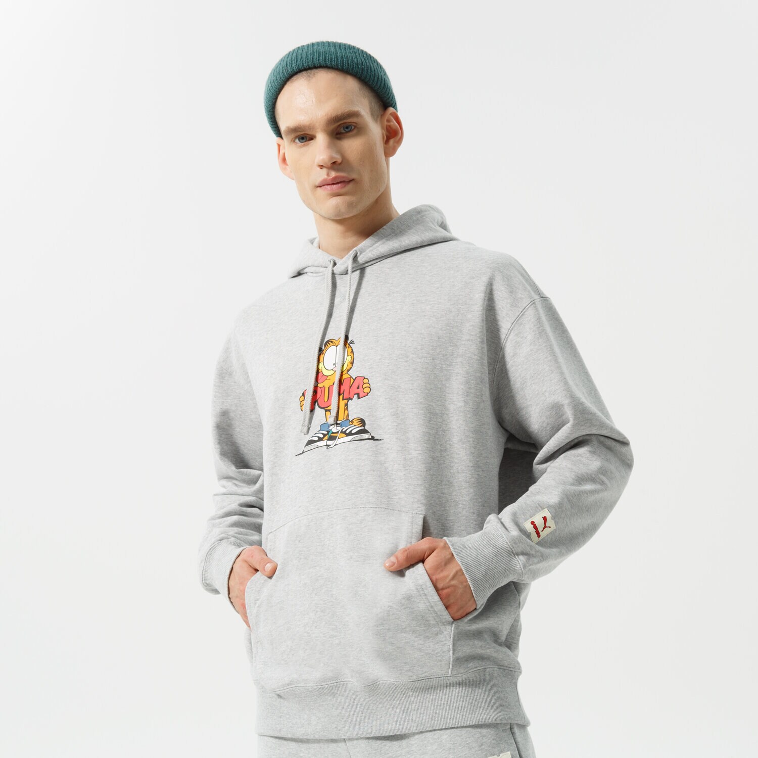 Muške dukserice PUMA VESTA S KAPULJAČOM PUMA X GARFIELD HOODIE 534435 04 siva
