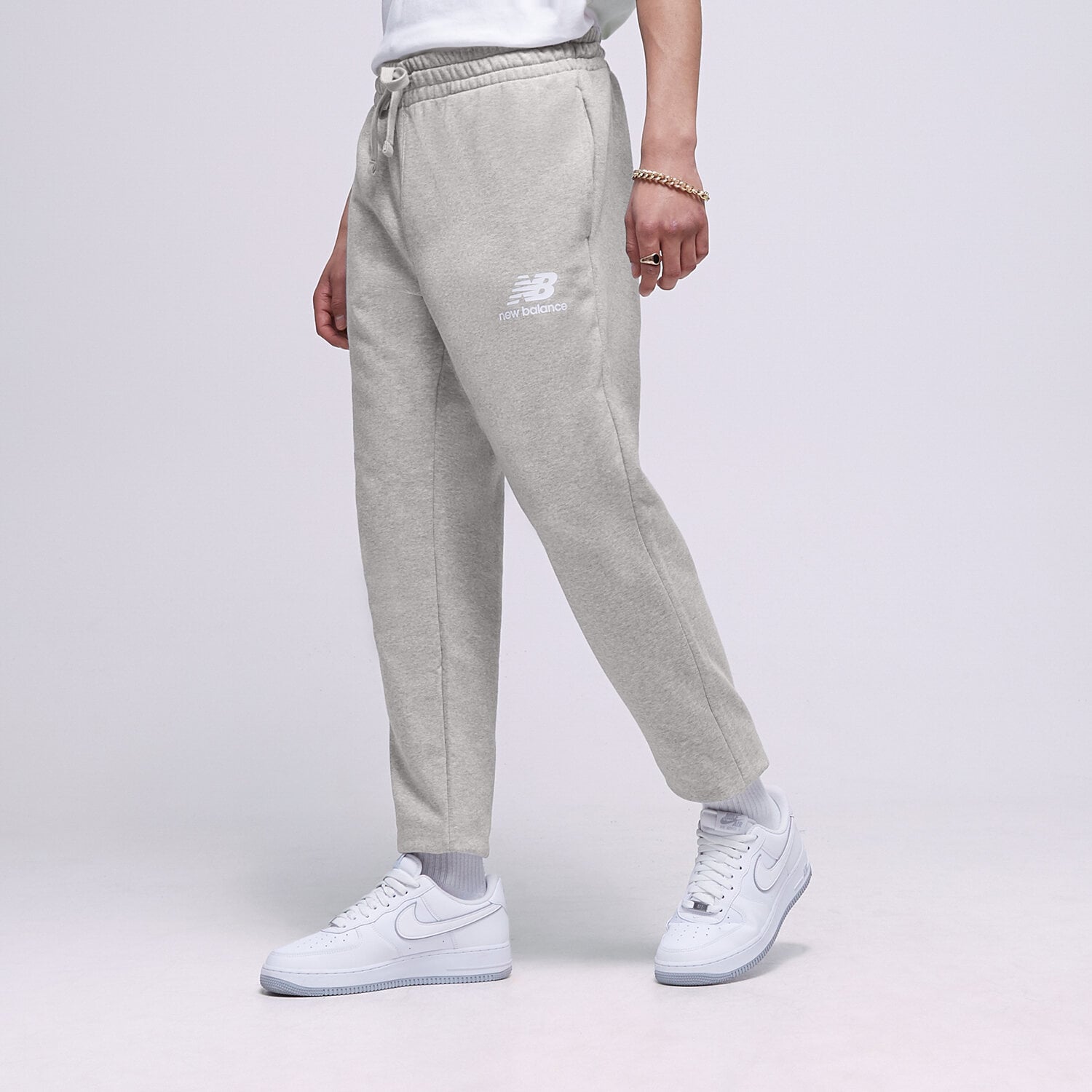 Muške hlače NEW BALANCE HLAČE NB ESSENTIAL STACKED MP31539AG siva
